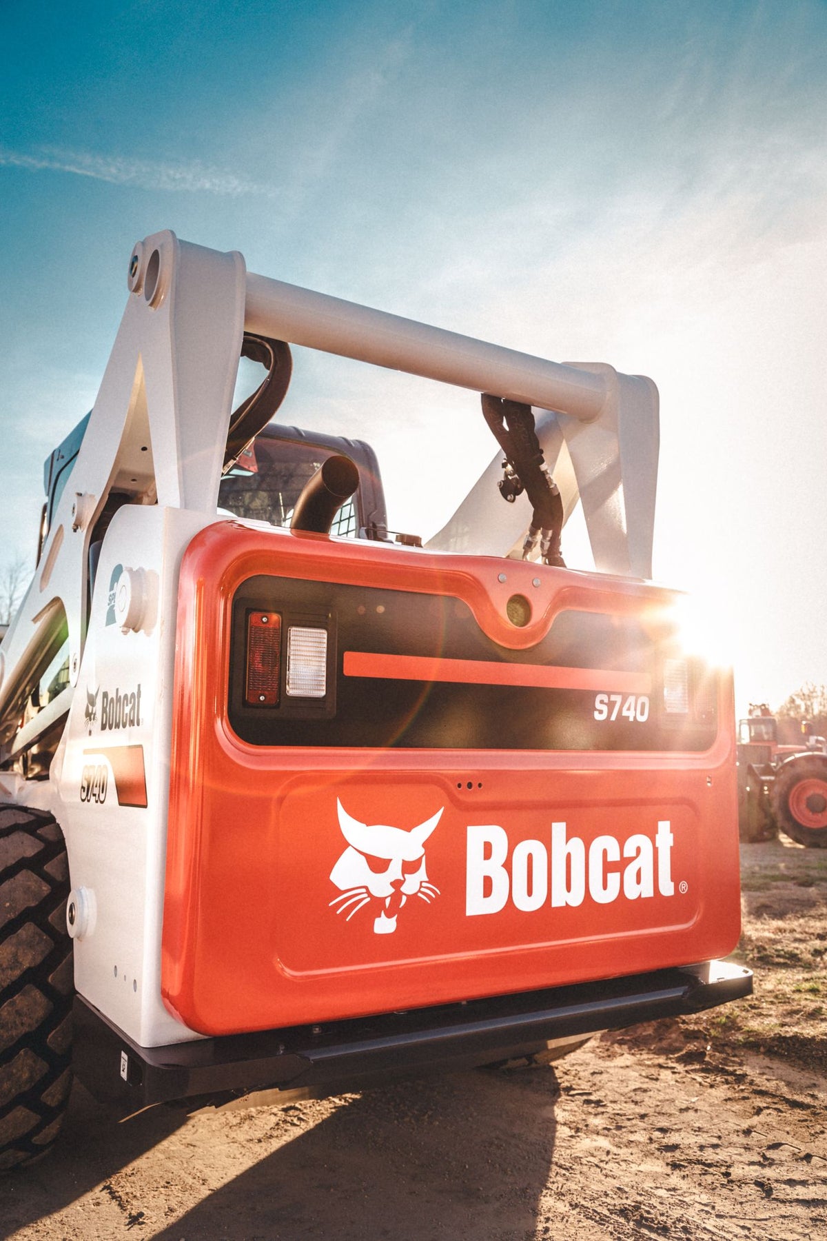 PLACEHOLDER - Bobcat skid steer loader parked outdoors