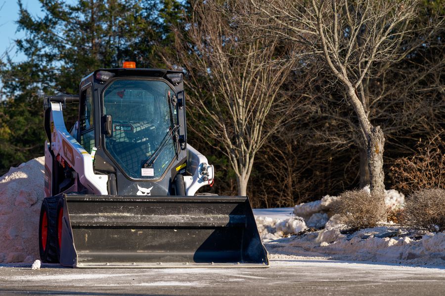 PLACEHOLDER - skid steer clearing snow
