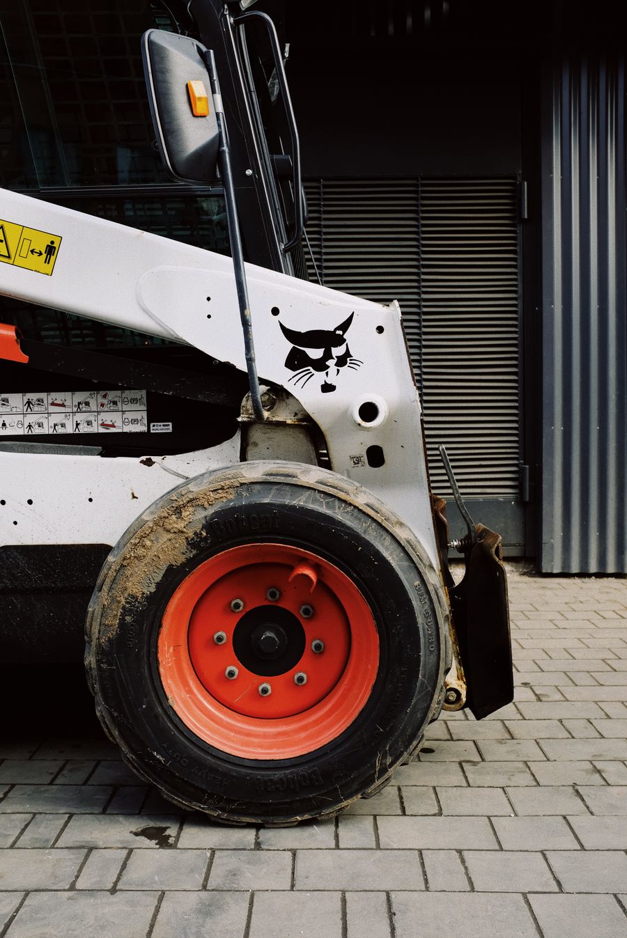 PLACEHOLDER - compact loader in a workshop
