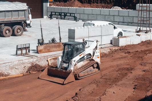 PLACEHOLDER - earthmoving machine and truck on a construction site