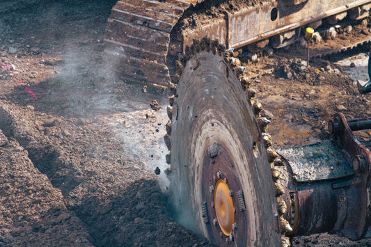 Trencher teeth cutting through earth