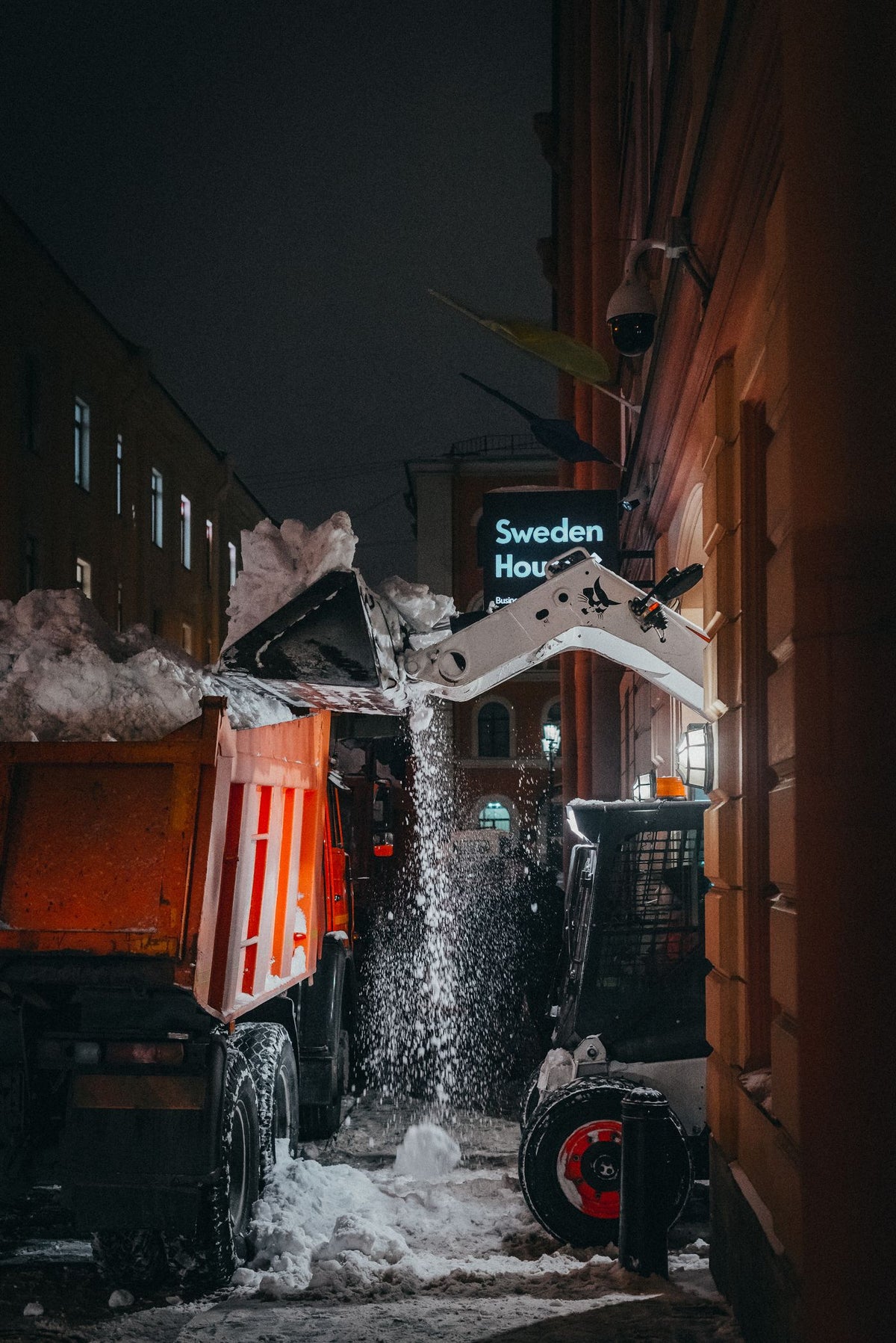 PLACEHOLDER - snow removal at night using a truck and skid steer